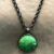 bronze / Green glass stone